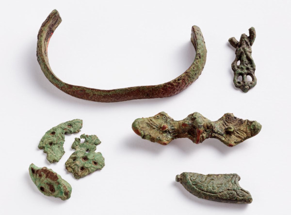 Pieces of an archaeological metal object.